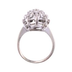 Vintage American diamond cluster white gold ring, circa 1950. This 14 karat white gold ring features a cluster of diamonds. The center round brilliant cut diamond is .25 carat surrounded by 25 round brilliant cut diamonds at .88 carat total weight. All diamonds have VS-SI clarity and G-H color. Total diamond weight is 1.13 carats. This diamond cluster ring is a size 6. Item #EROS D810 Classic Hallmarked Cluster Ring In 14k White Gold, White Sterling Silver Cluster Ring Hallmarked, Luxury Antique White Cluster Ring, 14k White Gold Multi-stone Cluster Ring, Service Merchandise Diamond Cluster Ring 1970s, 1 Carat Diamond Ring, Solvang Ca, Diamond Wedding Sets, Etsy Gold Ring