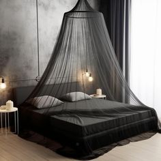 a bed with a mosquito net hanging over it's head and two night stands on either side