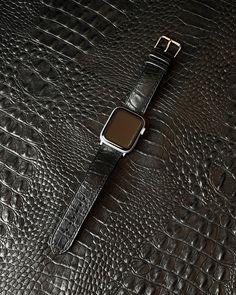 Meet our full grain classy black genuine leather watch strap. It is made of natural cow leather with crocodile embossed pattern. Due to the natural variations in the leather, no two are exactly alike bands! The leather has amazing texture without thorns which imitates a real skin of gator. the texture of the leather is almost 1:1 in appearance with natural crocodile, so the strap looks very expensive and presentable.  Distinctive skin texture, laconic black color, unique and attractive appearance make for a striking image. Our meticulously crafted bands with hand-painted edges and fine stitching bands are designed to add a touch of sophistication to any Apple Watch. Perfect Gift for Man, Father's Day Gift, Gift for Him. Compatible for: - all Apple Watch Series: 1, 2, 3, 4, 5, 6, 7, 8, 9, S Real Skin, Alligator Print, Embossed Pattern, Apple Watch Series 1, Leather Watch Strap, Apple Watch Strap, Skin Texture, Apple Watch Band, Apple Watch Series