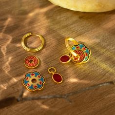 This versatile pair offers endless styling options, allowing you to create a unique look every time. These earrings come with 3 cute enamel pedants that can be worn all together or individually. The possibilities are endless. Don't limit yourself, have fun with your style! Materials: A thick 18K gold layer on brass with Enamel on top Weight: 0.4oz (total) Gem stone: N/A Size: 1 inch x 0.6 inch approx (each)   Care This piece should be stored in a cool, dry place and cleaned carefully with a soft non-abrasive cloth to maintain shine. Nickel-free Enamel Round Hoop Earrings, Nickel-free Enamel Hoop Earrings As Gift, Gem Stone, Have Fun, 1 Inch, Etsy Earrings, 18k Gold, Etsy Accessories, Hoop Earrings