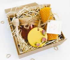 a box with honey and soaps in it