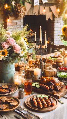 a table filled with food and candles on top of a wooden table covered in flowers