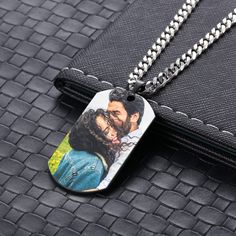 Celebrate your loved ones with a unique, timeless photo pendent. Our customizable design lets you upload a photo then place it inside of a circle surrounded by CZ stones. 💗 Easily upload photos from social media or phone 💗 Free shipping within the US ✔ Delicate customizations to make it one-of-a-kind Color: Black/Blue Material: Stainless steel Style: Personalized with photo upload and a date Chain length: 24" Weight: 38.5g/29.5g Stainless Steel Dog Tag Jewelry For Memorial, Personalized Black Pendant Jewelry, Personalized Black Pendant Necklace, Personalized Black Round Pendant Jewelry, Black Pendant Jewelry For Personalized Gift, Black Pendant Necklace For Personalized Gift, Black Round Pendant Necklace For Personalized Gift, Black Pendant Necklace For Anniversary Gift, Black Stainless Steel Jewelry For Anniversary