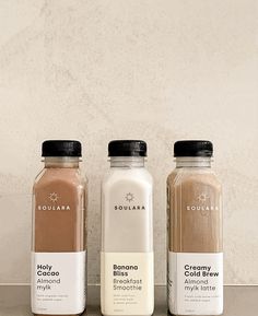 three different types of smoothies on a counter