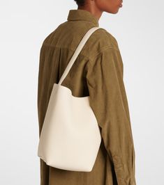 N/S Park Medium leather tote bag in white - The Row | Mytheresa Luxury Cream Leather Hobo Bag, Luxury Cream Leather Bucket Bag, Cream Bag With Leather Lining And Double Handle, Cream Double Handle Bag With Leather Lining, Classic Beige Hobo Bag With Smooth Grain, Classic Cream Hobo Bag, Cream Rectangular Bag With Leather Lining, Cream Leather Bucket Satchel, Luxury Cream Soft Leather Hobo Bag