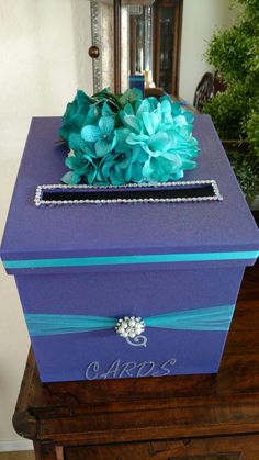 a purple box with blue flowers on it