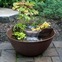 a planter filled with water and flowers