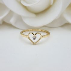 Our Adorable solid Gold Heart Solitaire CZ ring is crafted in Solid 14k Gold which makes it perfect to wear everyday and in every occasion.this ring is simple yet perfect. Unique, elegant and everlasting. 14k Gold will not tarnish or rust. Materials: 14k Gold, CZ Diamonds Stone size: 2mm Heart size: 8x7mm Band width: 1.5mm Weight: 1.3 grams 14k stamped  Brand new Follow us in our social media for more solid 14k Gold Jewelry. Please. Do not hesitate to contact me i will be happy to answer all you 14k Gold Heart Ring With Single Diamond For Gift, Heart-shaped Single Diamond Ring Gift, Heart Shaped Single Diamond Ring For Gift, Heart Shaped Single Diamond Gift Ring, Heart-shaped Single Diamond Gift Ring, Everyday Open Heart Rings With Heart Charm, Minimalist White Ring For Valentine's Day, 14k Gold Heart-shaped Solitaire Ring, Delicate Stackable Promise Rings For Valentine's Day