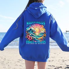 Embrace the serene vibes of the ocean with our Happiness Comes In Waves Hooded Sweatshirt. This cozy and stylish hoodie is perfect for beach lovers, surfers, and anyone who finds joy in the waves. Whether you're heading to the beach, planning a summer vacation, or just want a comfortable piece for everyday wear, this sweatshirt has got you covered. Features: High-Quality Material: Made from soft, durable fabric to keep you warm and comfortable. Unique Design: "Happiness Comes In Waves" print captures the essence of beach life and relaxation. Perfect Fit: Available in various sizes to ensure the perfect fit for everyone. Versatile Wear: Ideal for beach outings, casual day wear, or cozy nights in. Great Gift Idea: Perfect for birthdays, holidays, or just because - a thoughtful gift for beach Hooded Letter Print Sweatshirt For Surfing, Long Sleeve Hoodie With Letter Print For Surfing, Hooded Sweatshirt With Letter Print For Surfing, Beach Season Long Sleeve Hoodie With Drawstring, Relaxed Fit Hooded Sweatshirt For Beach, Surfing Graphic Print Long Sleeve Hoodie, Casual Blue Hoodie For Beach, Blue Relaxed Fit Sweatshirt For Beach Season, Blue Beach Hoodie With Letter Print