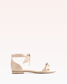 Clarita Flat Sandal in Nappa Leather | Alexandre Birman Summer Bow Flats, Summer Flats With Bow, Flat Bow Sandals For Spring, Chic Leather Ankle Tie Sandals, Chic Leather Lace-up Sandals With Low Heel, Flat Heel Leather Sandals With Bow, Chic Low Heel Sandals With Bow Straps, Leather Sandals With Bow And Flat Heel, Leather Flat Heel Sandals With Bow