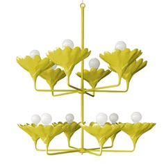 a yellow chandelier with white balls hanging from it