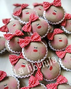 many small teddy bears with red bows on them