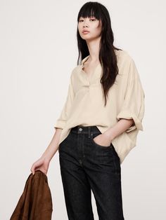 Cut for an oversized fit and longer length, this popover shirt is crafted from a silky, soft twill with fluid drape.  We left off the buttons this time, leaving the collar open for an at-ease appeal.  Oversized fit with a dropped shoulder.  Point collar.  Straight hem.  Unlined.  Oversized fit with a dropped shoulder.  3/4 sleeves.  Hip length.  Model: Size S, 5'10" (178cm). Popover Shirt, Top Banana, Big And Tall, Hip Length, Oversized Fits, Womens Clothing Tops, Banana Republic, Personal Style, Fashion Inspo