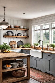 a kitchen with gray cabinets and wooden shelves filled with pots, pans, and plates