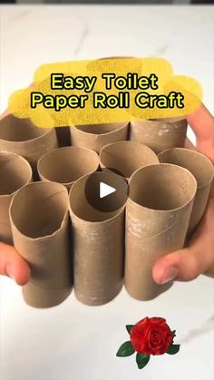 a person holding up some toilet paper rolls with the words easy toilet paper roll craft on it