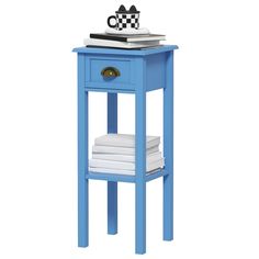 a blue end table with a stack of books on top