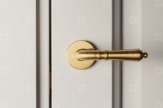 a close up of a door handle on a white door