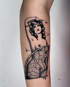 a woman's arm with a tattoo on it