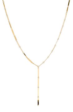 Crafted from polished 14-karat gold, this lariat necklace can be worn as a singular or layered piece. 16" length 14k gold Made in the USA Formal Long Drop Chain Necklace, Timeless Lariat Necklace With Adjustable Long Drop Chain, Minimalist 14k Yellow Gold Lariat Necklace, Timeless Long Drop Lariat Necklace With Adjustable Chain, Modern Gold Long Drop Necklace, Timeless Yellow Gold Long Drop Necklace, Timeless Long Drop Yellow Gold Necklace, Luxury Gold Lariat Necklace With Long Drop, Luxury Gold Long Drop Lariat Necklace