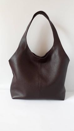 "This hand bag is crafted from textured soft leather in brown . It's the ideal size for taking you from desk to dinner, and can be worn over the shoulder for hands-free. - Two shoulder straps. - Pleated top with magnetic fastening. - You can choose from 8 leather colors. - Cotton lining with zip close compartment for securing your necessities, you can choose from 7 different linings. Free delivery is economic delivery. We use Latvian post and delivery can take 1-3 weeks in the EU, 3-4 weeks ever Brown Leather Bucket Bag With Rolled Handles, Brown Textured Faux Leather Shoulder Bag, Brown Satchel Bucket Bag With Rolled Handles, Brown Textured Leather Hobo Bag With Double Handles, Brown Satchel With Rolled Handles, Leather Hobo Bag With Rolled Handles, Brown Hobo Bag With Soft Leather And Double Handle, Brown Textured Leather Hobo Tote Bag, Brown Soft Leather Hobo Bag With Double Handle