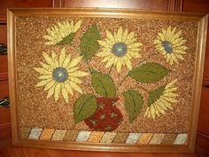 a painting with sunflowers in a vase on the floor next to a dresser