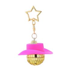 a pink hat with a star on top hanging from a keychain ornament