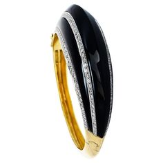 This exquisite 1980s bracelet is a dome made of diamond & highly polished black onyx. the bracelet features 3 cabochon-free forms cut Black onyx gemstones, a bezel set measuring 3 " long x 3 mm wide. 140 sparkly round cut, natural genuine diamonds, pave set, weighing in total approximately 3.00 carats, G-H color, and VS clarity crafted in solid heavy 14K yellow gold with an approximate total weight of 51.6 grams. The whole piece’s approximate wrist size is 6”, 16 mm in height, secured with an in Bezel Setting, Black Onyx, Bangle Bracelet, Unique Pieces, Onyx, Bangle Bracelets, Jewelry Bracelets, Bangles, Yellow Gold