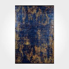 an abstract blue and gold rug on a white wall with a black frame in the middle