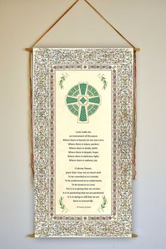 a plaque hanging on a wall with a poem written in the center and an image of a cross