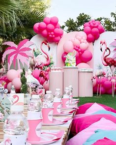 pink flamingo themed birthday party with balloons and decorations