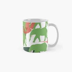 an elephant and giraffes pattern on a green background classic white coffee mug