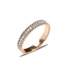 a gold and diamond ring on a white background