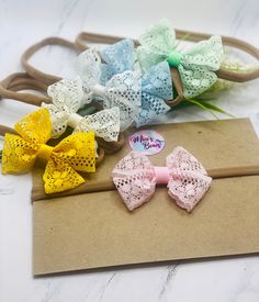 This listing is for ONE gorgeous Lace Bow or baby lace Headband, perfect for a ponytail and holding hair out of the eyes. This hair bow is suitable for newborn babies, toddlers, and little girls. This adorable bow/Headband is perfect for any outfit  Choose your color: White, Ivory, Pink, yellow, green, or blue. Measuring approximately 2'8 x 2'5 inches.  Good to Know:  *All of the items are crafted at a pet / smoke-free home. Follow us on Instagram  @mias.bows for shop updates, sales, and new items Tag us in photos of your little ones wearing our bows. Feel free to contact me with any questions or concerns. Adjustable Headband With Bow Tie For Gifts, Adjustable Bow Tie Headband As Gift, Adjustable Bow Tie Headband For Gift, Lace Hair Bows, Cute Butterfly Knot Headband Gift, Adjustable Bow Tie Hair Accessories As Gift, Adjustable Hair Accessories With Butterfly Knot For Gifts, White Headband For First Birthday, Cute First Birthday Headband