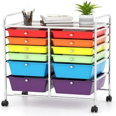 multicolored storage bins with wheels on the bottom and one is holding books