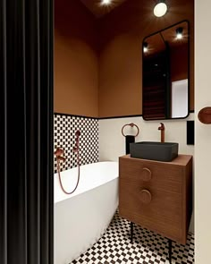 a bathroom with black and white checkered tile on the floor, walls, and bathtub