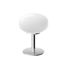 a white table lamp sitting on top of a metal stand