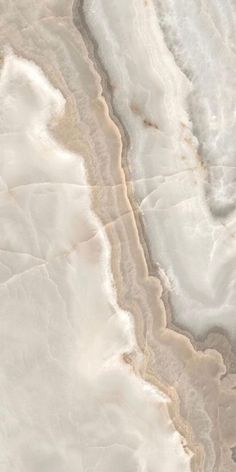 an aerial view of some white and brown marble