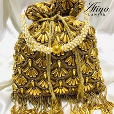 Beautifully Handcrafted Beaded Handbag Made From Satin Crepe. Designer Gold Tote Box Bag, Designer Bucket Bag As Gift, Designer Gold Satchel Bag, Designer Gold Pouch Shoulder Bag, Designer Gold Rectangular Bucket Bag, Designer Gold Bucket Shoulder Bag, Elegant Gold Bucket Satchel, Gold Bucket Bag With Removable Pouch, Luxury Gold Pouch Satchel