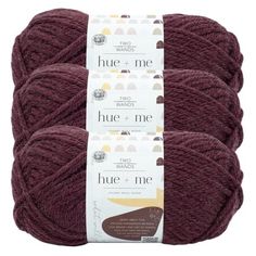 three skeins of yarn in burgundy