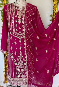 It is a beautiful ready to wear dress for women. It is available in large size. Chest 45 inches all around, waist 46, hips 48 and length 42 inches. It is a beautiful embroided Kameez with tilla, sequins, zardozi and pearls work on it. It comes with beautiful matching cut work embroided dupatta. It comes with jamawar pant. It is a master copy of agha noor brand. Color hot pink. Fabric chiffon. No return or exchange please . Full lining attached in sleeves. Bollywood Style Dabka Salwar Kameez For Navratri, Unstitched Bollywood Lawn Suit For Festive Season, Designer Dabka Salwar Kameez For Navratri, Navratri Designer Salwar Kameez With Dabka, Semi-stitched Bollywood Lawn Suit For Festive Occasions, Bollywood Style Straight Kurta Salwar Kameez In Chinon, Bollywood Style Straight Kurta Lawn Suit For Festivals, Eid Salwar Kameez With Sheer Dupatta In Nida, Sheer Dupatta Anarkali Set In Nida