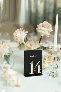 a table with flowers and candles is set up for a formal dinner or wedding reception