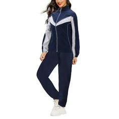 Women's classic relaxed fit tracksuit comes with a traditional retro design with a stripe across the chest. Full zip closure can be zipped all the way up for a stand collar, look or left unzipped for a more casual spread collar appearance. Made out of lightweight soft material, this 2 piece tracksuit is ideal for casual all day wear running errands or can also be used for exercising, gym workouts, jogging or other activities. The material is breathable & water resistant. Material: 100% Polyester Casual Cotton Track Jacket For Jogging, Casual Navy Tracksuit For Sports, Sporty Tracksuit With Pockets For Leisure, Blue Athleisure Tracksuit For Leisure, Navy Long Sleeve Tracksuit In Athleisure Style, Navy Casual Tracksuit For Sports, Navy Casual Tracksuit For Streetwear, Casual Navy Tracksuit For Streetwear, Blue Sportswear Tracksuit For Leisure