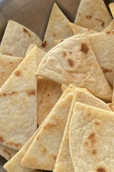 some tortilla chips are in a bowl