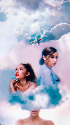 two women standing in the clouds with one woman looking up