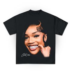 a black t - shirt with an image of a smiling woman