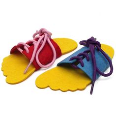 two pairs of colorful shoes with laces on the bottom and one pair in red, yellow and blue