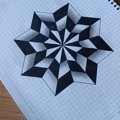 an image of a paper with a black and white design on it that looks like a star