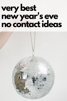 a silver disco ball with the words ring in 2021 with the best no contact ideas