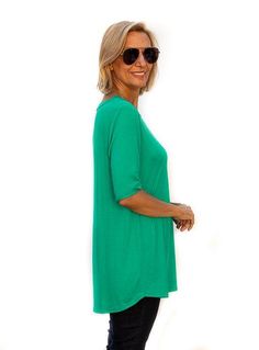 Take a look at our beautiful Kelly Green Round Neck Elbow Length Sleeve Top Knit fabric Content: 95% Rayon 5% Spandex Semi loose body with elbow length sleeves Round neck finished with a 3/4" band Sides slightly shorter than front and back Center back length is 29" Green Stretch Top With 3/4 Sleeves, Elbow Length Sleeve, Top Fabric, Kelly Green, Soft Knits, Knit Fabric, Knitted Fabric, Length Sleeve, Tunic Tops