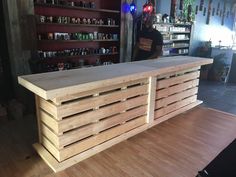 a bar made out of wooden pallets in a store